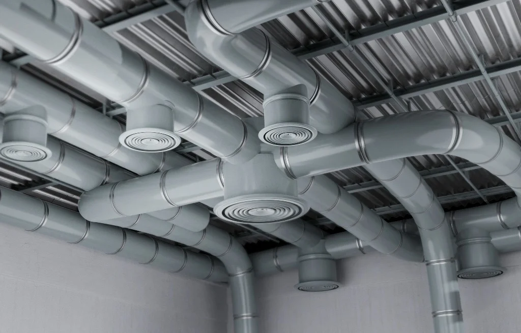 Professional technician installing a rigid metal duct to illustrate dryer vent installation cost factors.